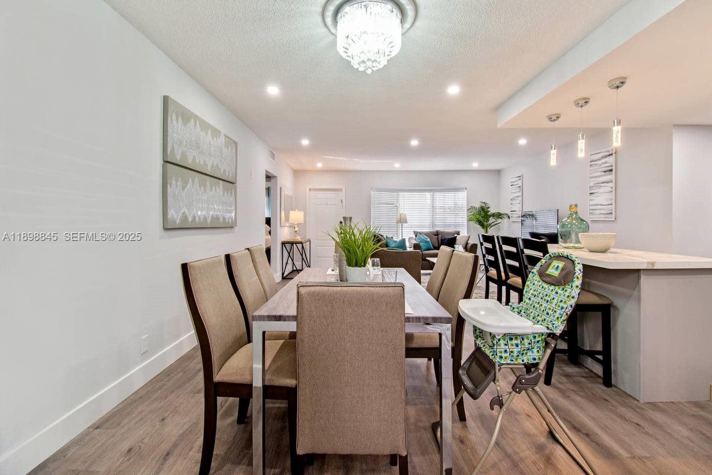 1305 Funston Street Hollywood, FL 33019 - Photo 93 of 93 a view of a dining room with furniture and wooden floor