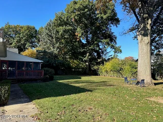 a room with pool table and glass windows