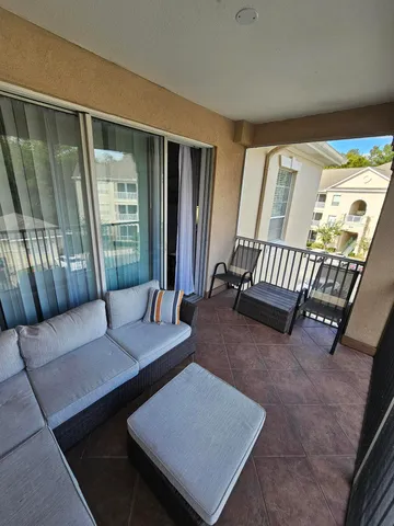 a living room with furniture rug and a window