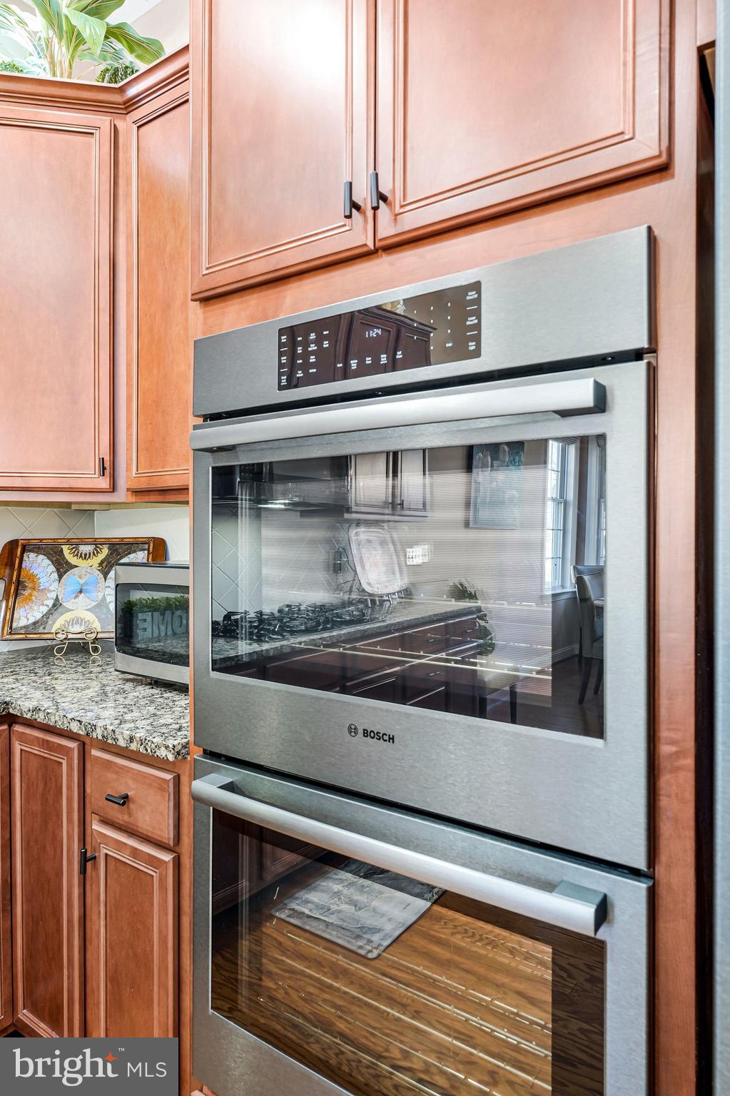 15517 Legacy Way Haymarket, VA 20169 - Photo 13 of 68 a close view of a stove top oven sitting inside of a kitchen