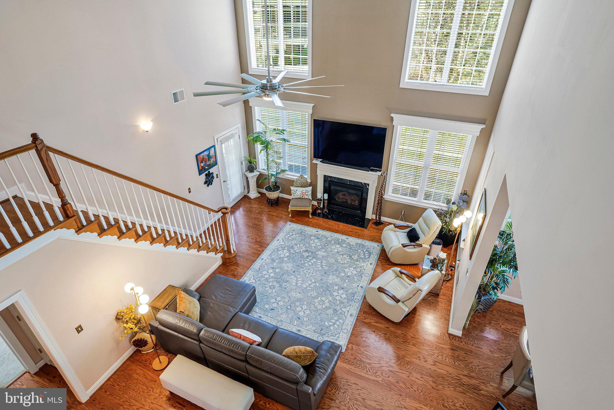 15517 Legacy Way Haymarket, VA 20169 - Photo 18 of 68 an living room with furniture fireplace and a flat screen tv