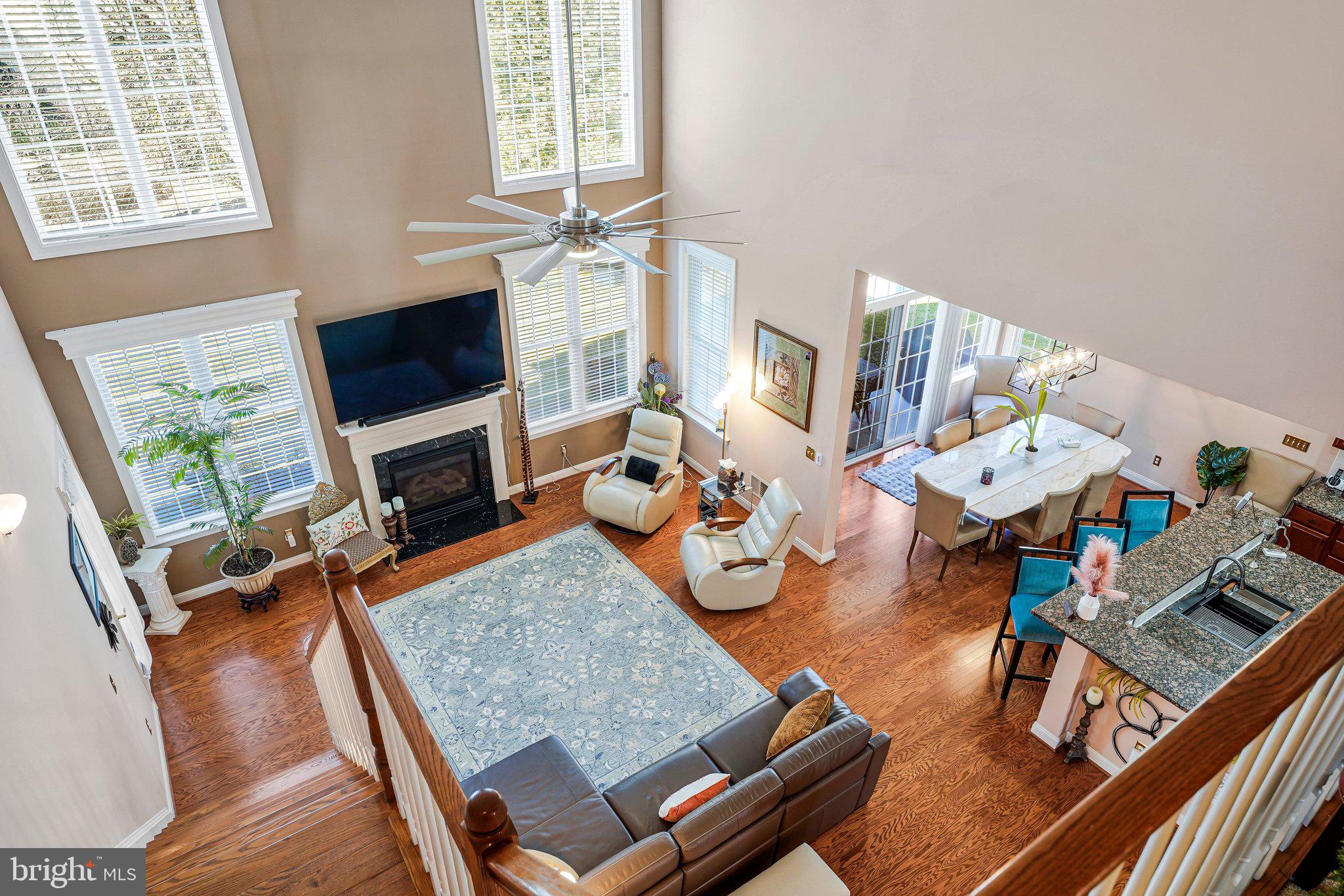 15517 Legacy Way Haymarket, VA 20169 - Photo 19 of 68 a living room with furniture a rug and a flat screen tv