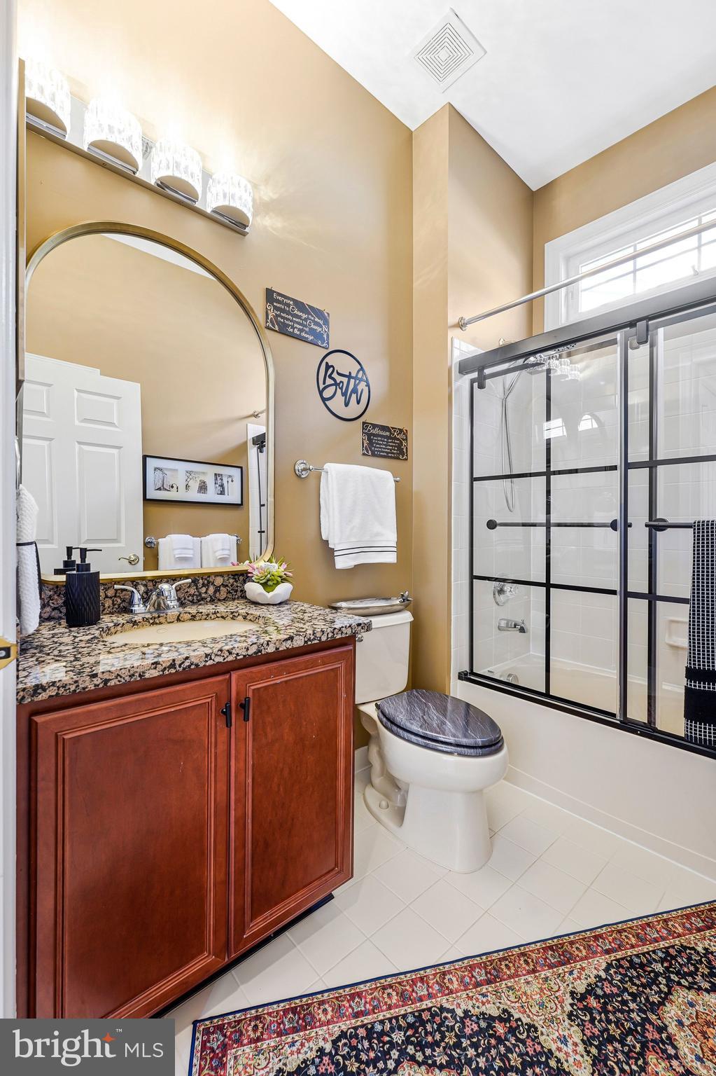 15517 Legacy Way Haymarket, VA 20169 - Photo 23 of 68 a bathroom with a sink a toilet and mirror