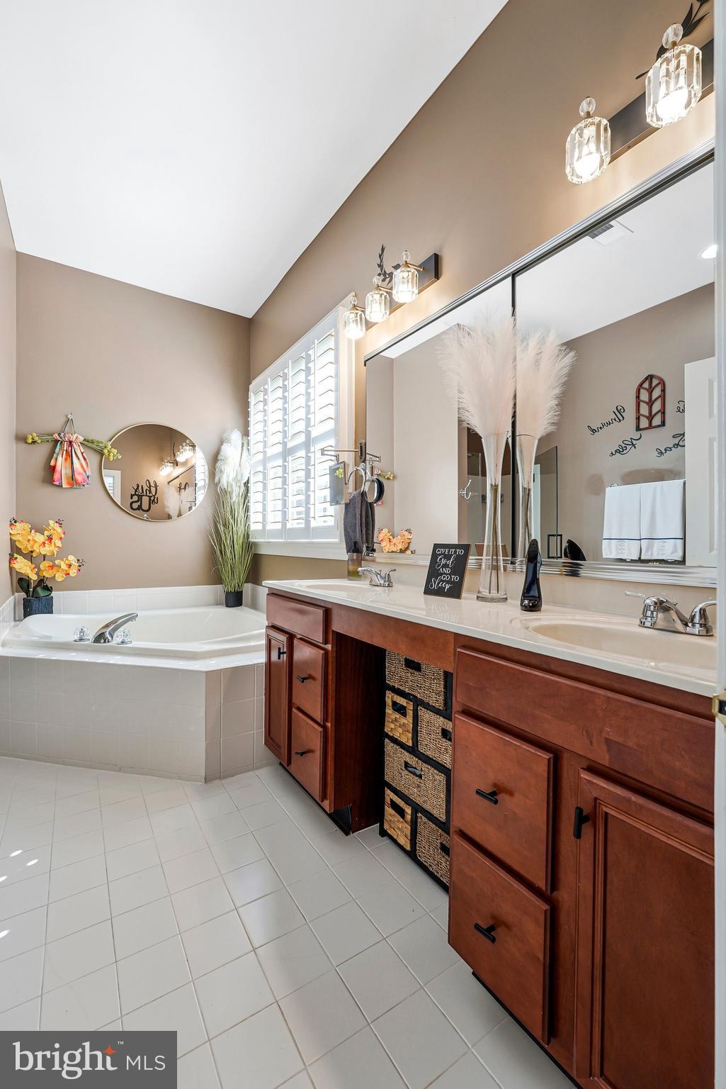 15517 Legacy Way Haymarket, VA 20169 - Photo 26 of 68 a spacious bathroom with a tub sink and mirror