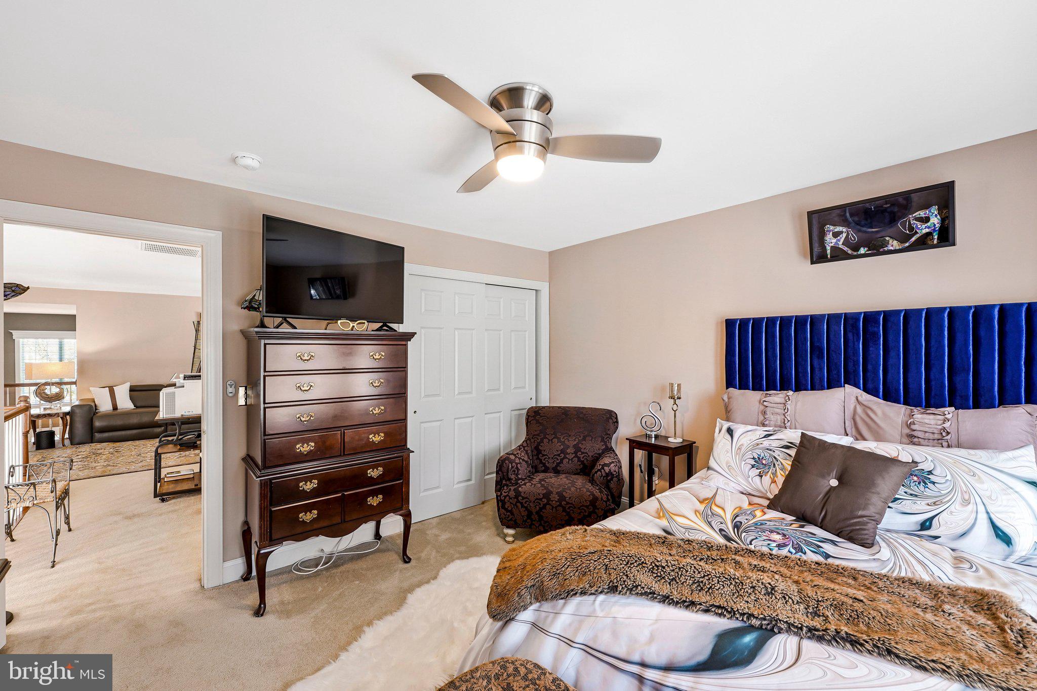 15517 Legacy Way Haymarket, VA 20169 - Photo 35 of 68 a bedroom with furniture and a flat screen tv
