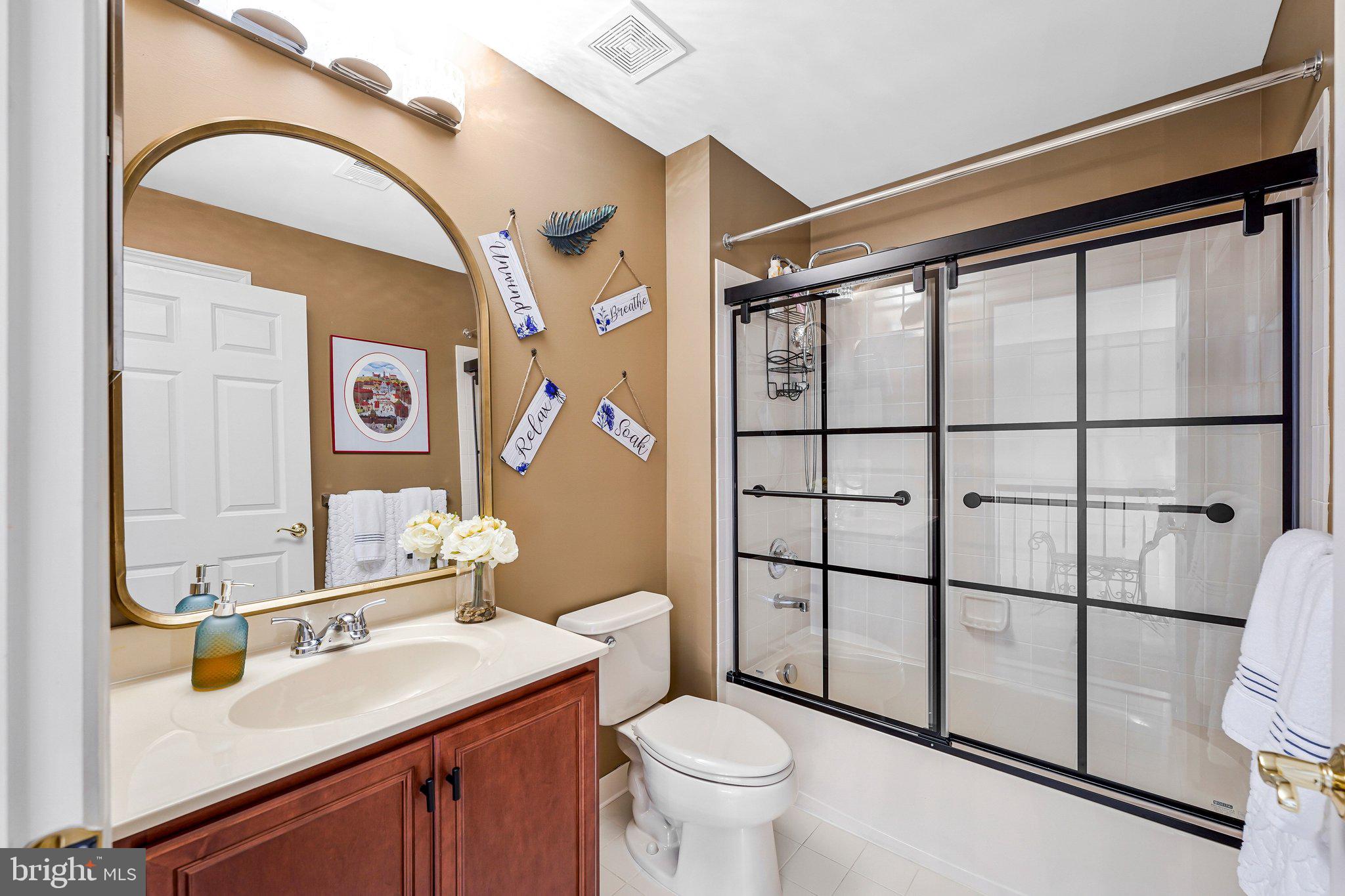 15517 Legacy Way Haymarket, VA 20169 - Photo 36 of 68 a bathroom with a sink toilet and shower
