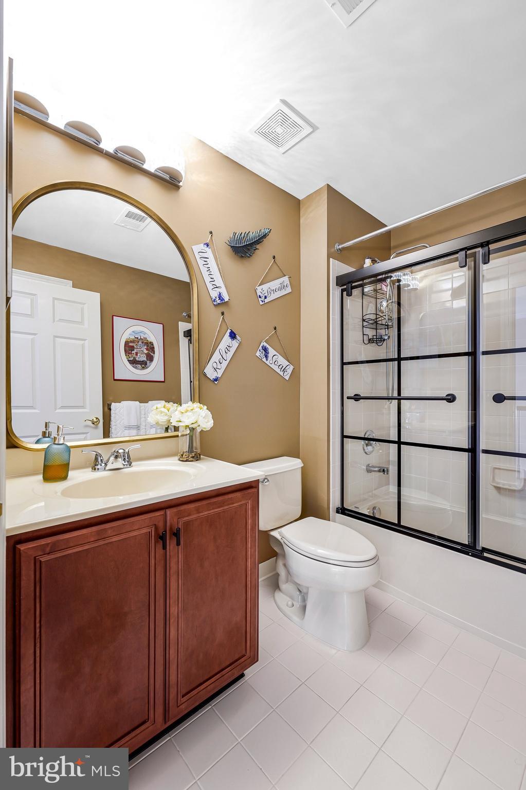 15517 Legacy Way Haymarket, VA 20169 - Photo 37 of 68 a bathroom with a toilet sink and mirror