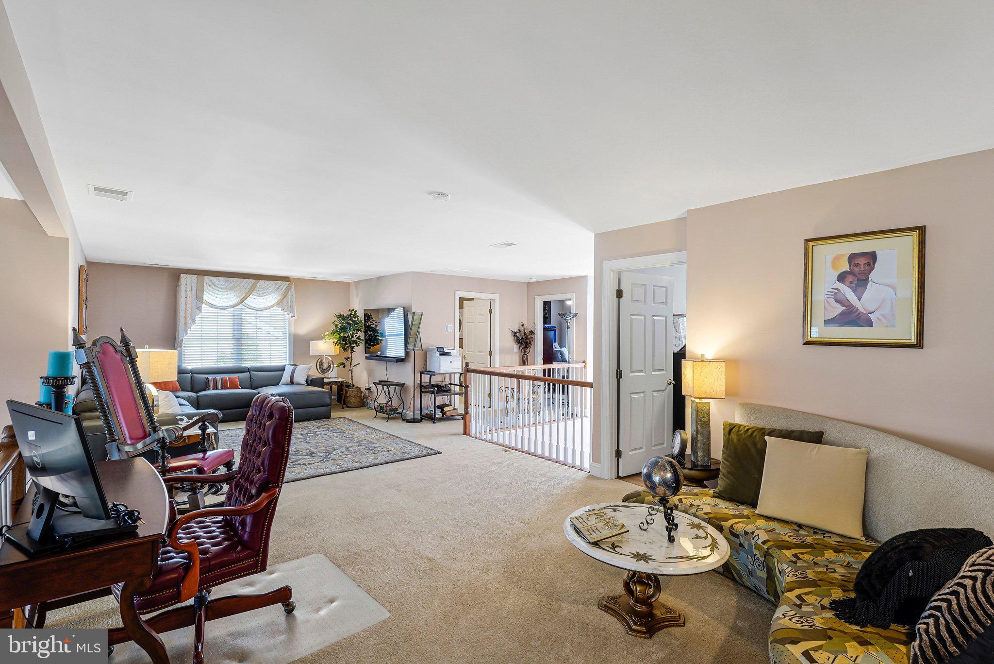 15517 Legacy Way Haymarket, VA 20169 - Photo 40 of 68 a living room with furniture a rug and a table