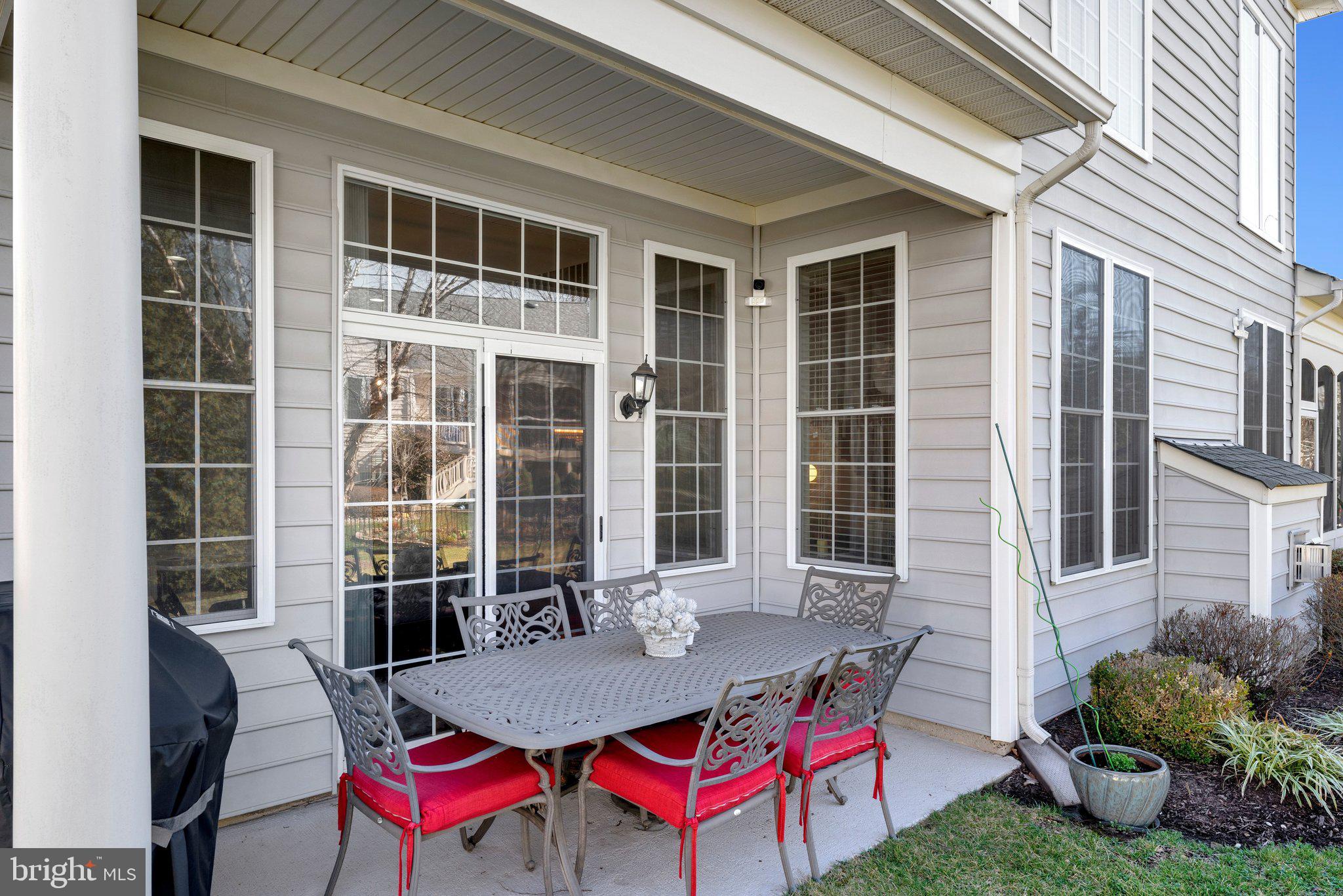 15517 Legacy Way Haymarket, VA 20169 - Photo 48 of 68 a view of a house with a backyard and sitting area