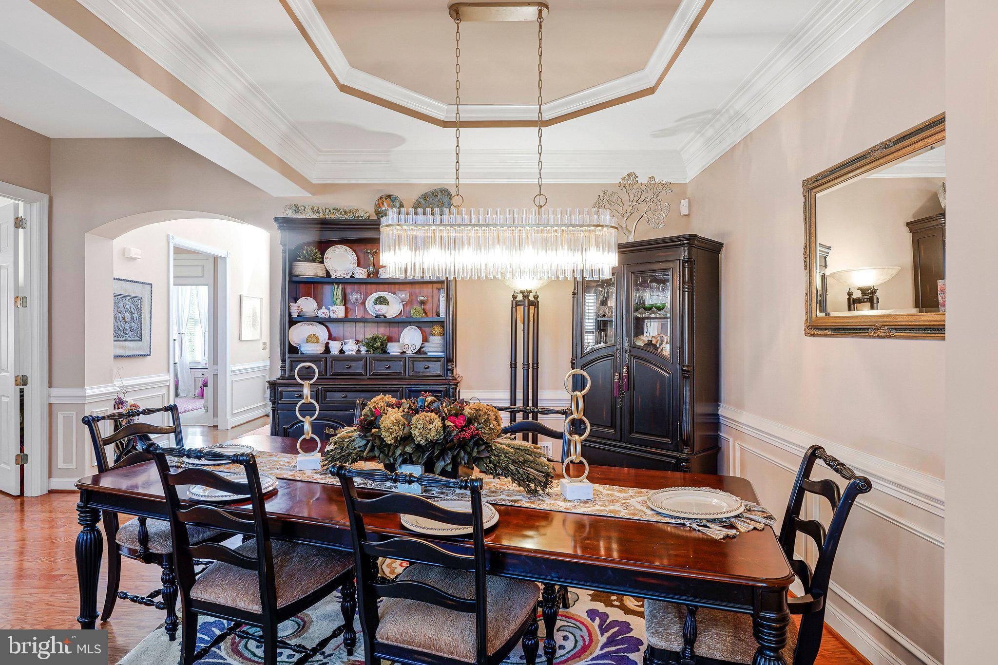 15517 Legacy Way Haymarket, VA 20169 - Photo 4 of 68 a view of a dining room with furniture and chandelier