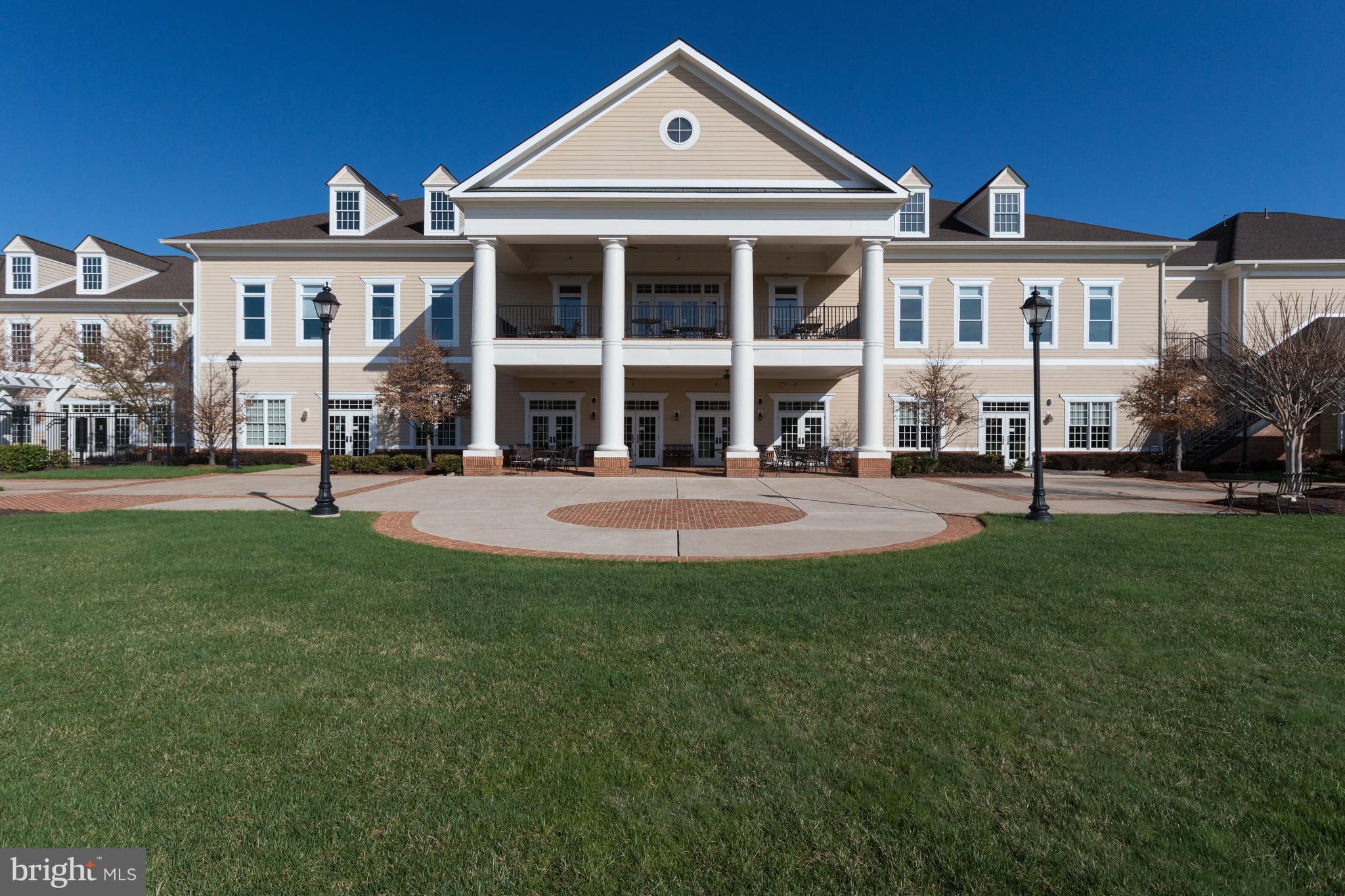 15517 Legacy Way Haymarket, VA 20169 - Photo 58 of 68 a front view of a building with a yard