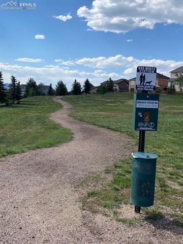 253 Talus Road Monument, CO 80132 - Photo 5 of 5 Jackson Creek Community has both unpaved and paved walking and running trails. You will find these dog stations and park benches within the neighborhood.