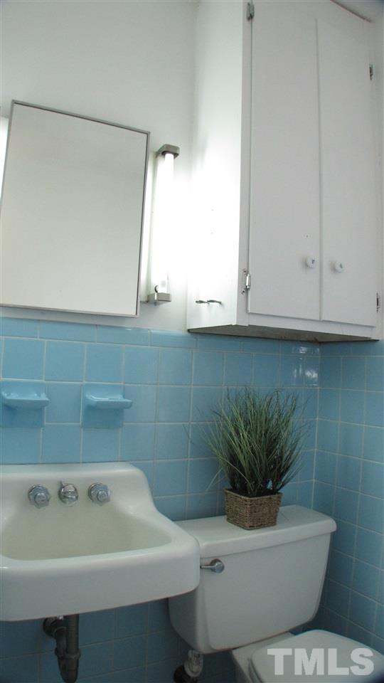 1210 Hamlin Road Durham, NC 27704 - Photo 15 of 18 The Half Bath is located in the Master.