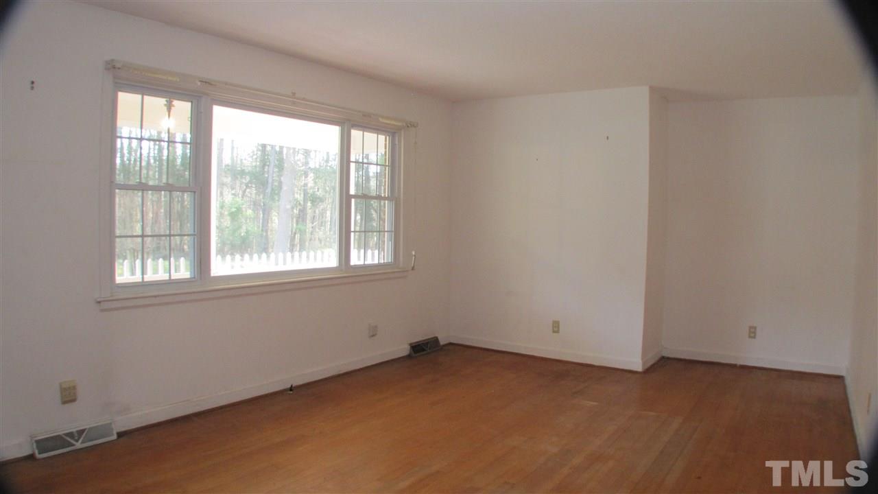 1210 Hamlin Road Durham, NC 27704 - Photo 5 of 18 The Family Room has Hardwood Floors and Ample Lighting.