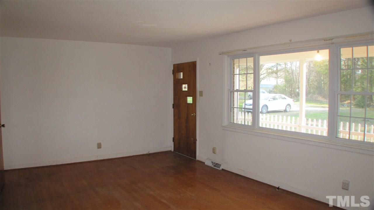 1210 Hamlin Road Durham, NC 27704 - Photo 7 of 18 The Family Room is located in the Front of the home and the entry is the covered front porch.