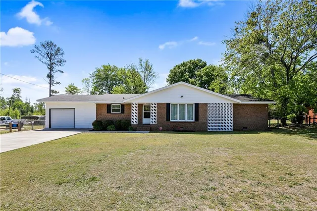 a front view of a house with yard