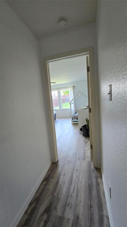 9520 George Washington Drive McKinney, TX 75072 - Photo 4 of 13 a view of a room with wooden floor a sink and a window