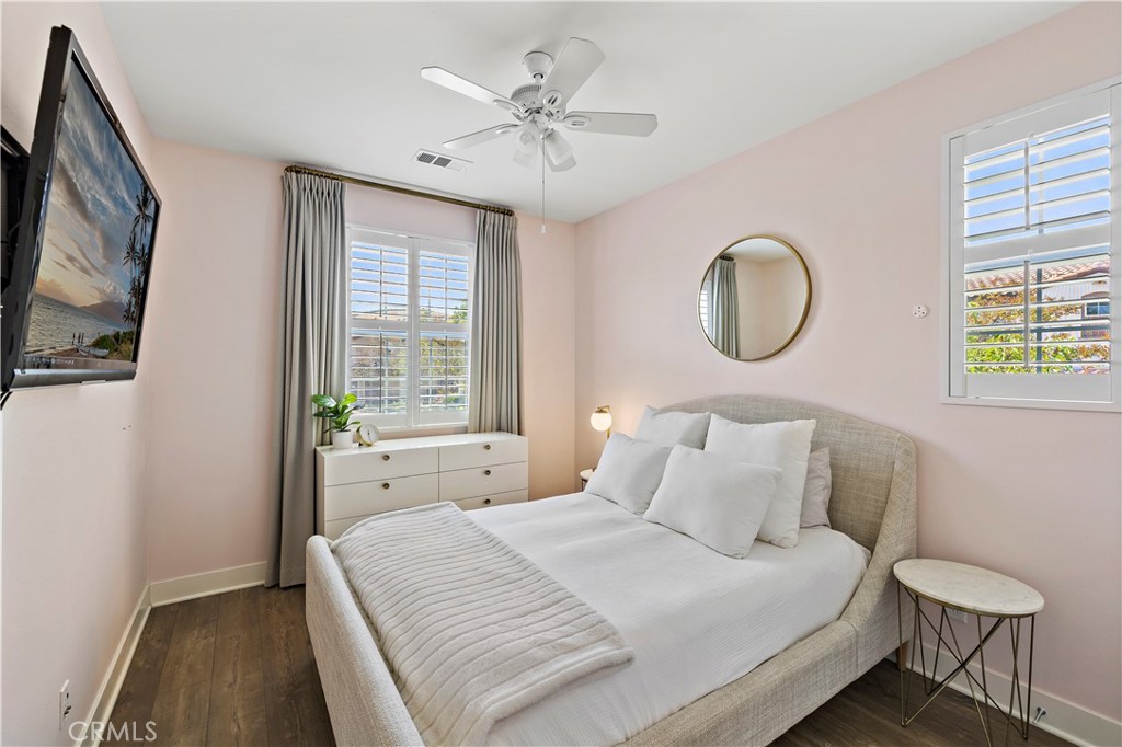 2 Agrios Street Rancho Mission Viejo, CA 92694 - Photo 11 of 29 a bedroom with a bed and a chandelier