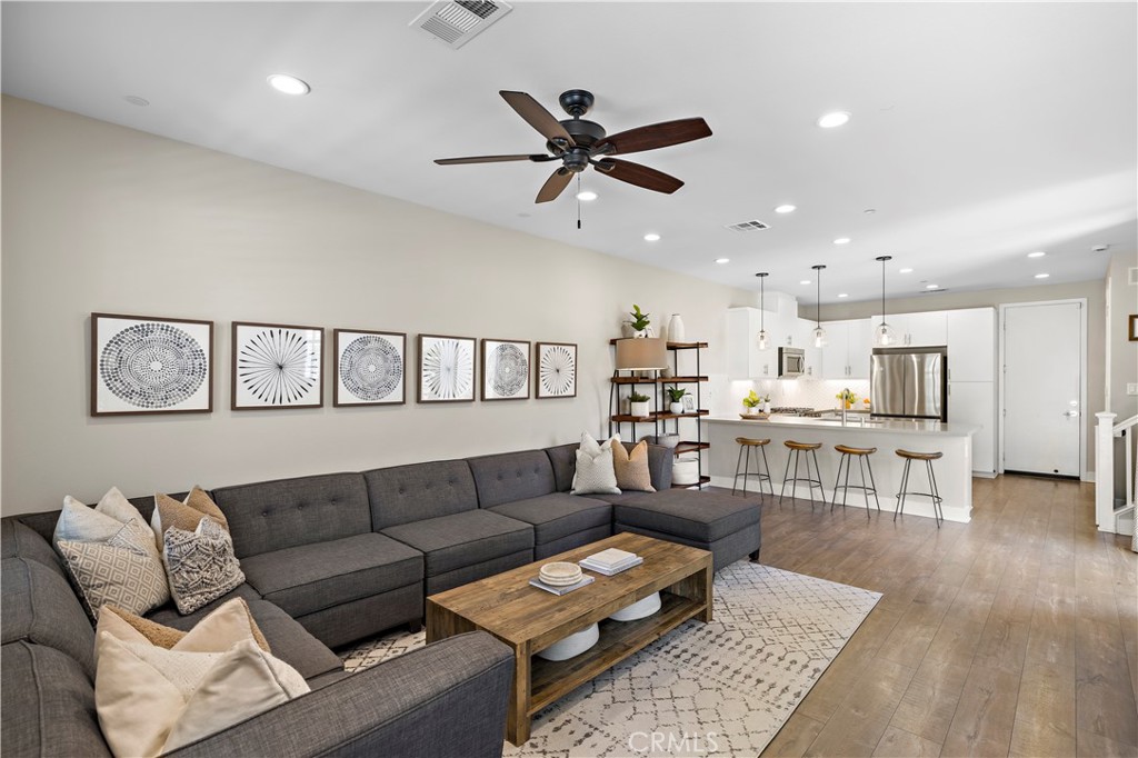 2 Agrios Street Rancho Mission Viejo, CA 92694 - Photo 2 of 29 a living room with furniture and kitchen view