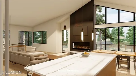 a living room with furniture and large windows