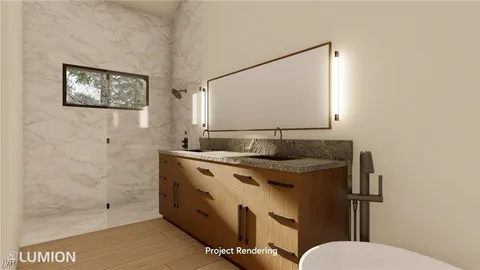 a bathroom with a granite countertop sink mirror vanity and toilet