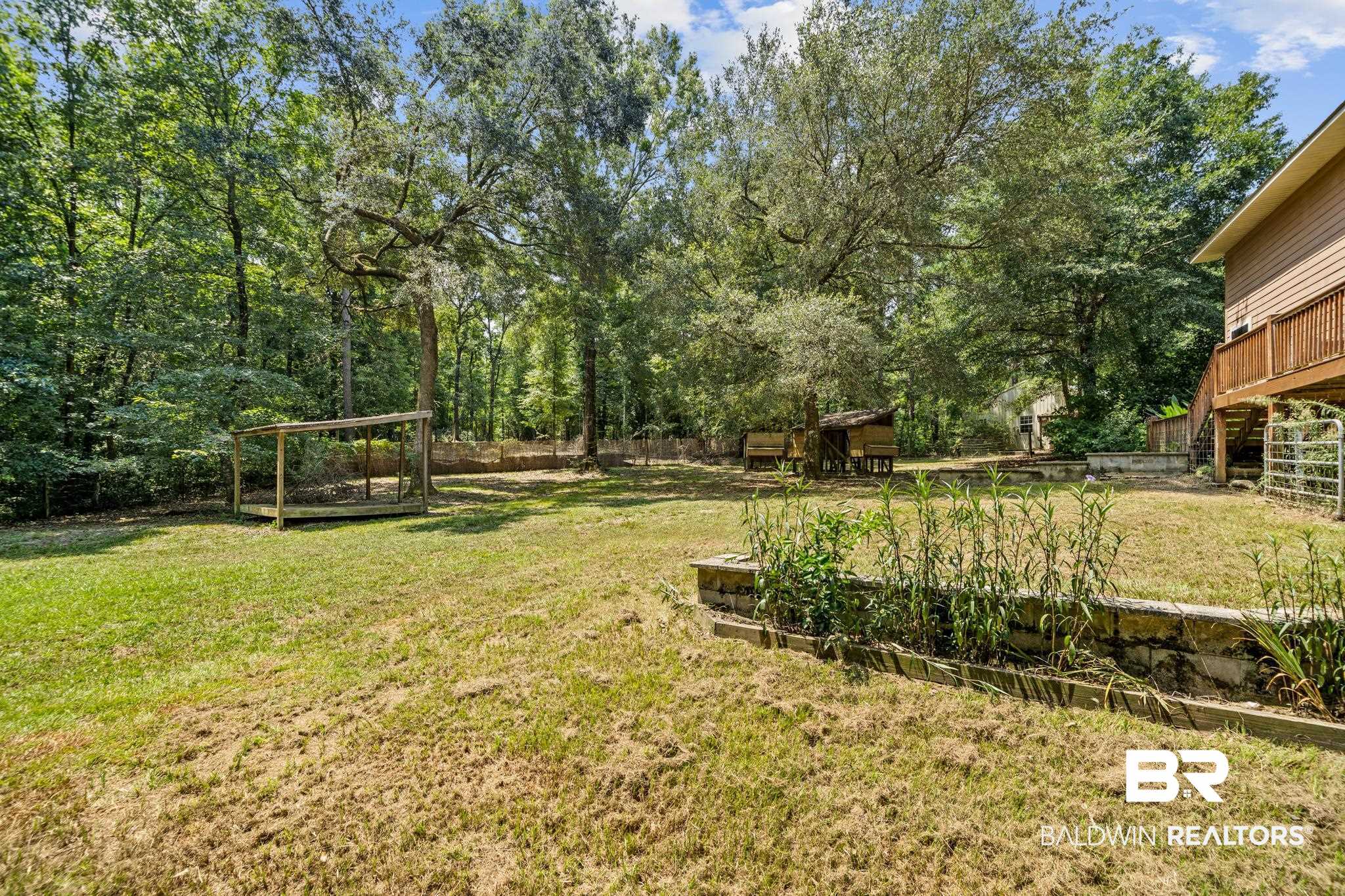 8321 Dixon Road Bay Minette, AL 36507 - Photo 14 of 79 View of yard featuring a wooden deck