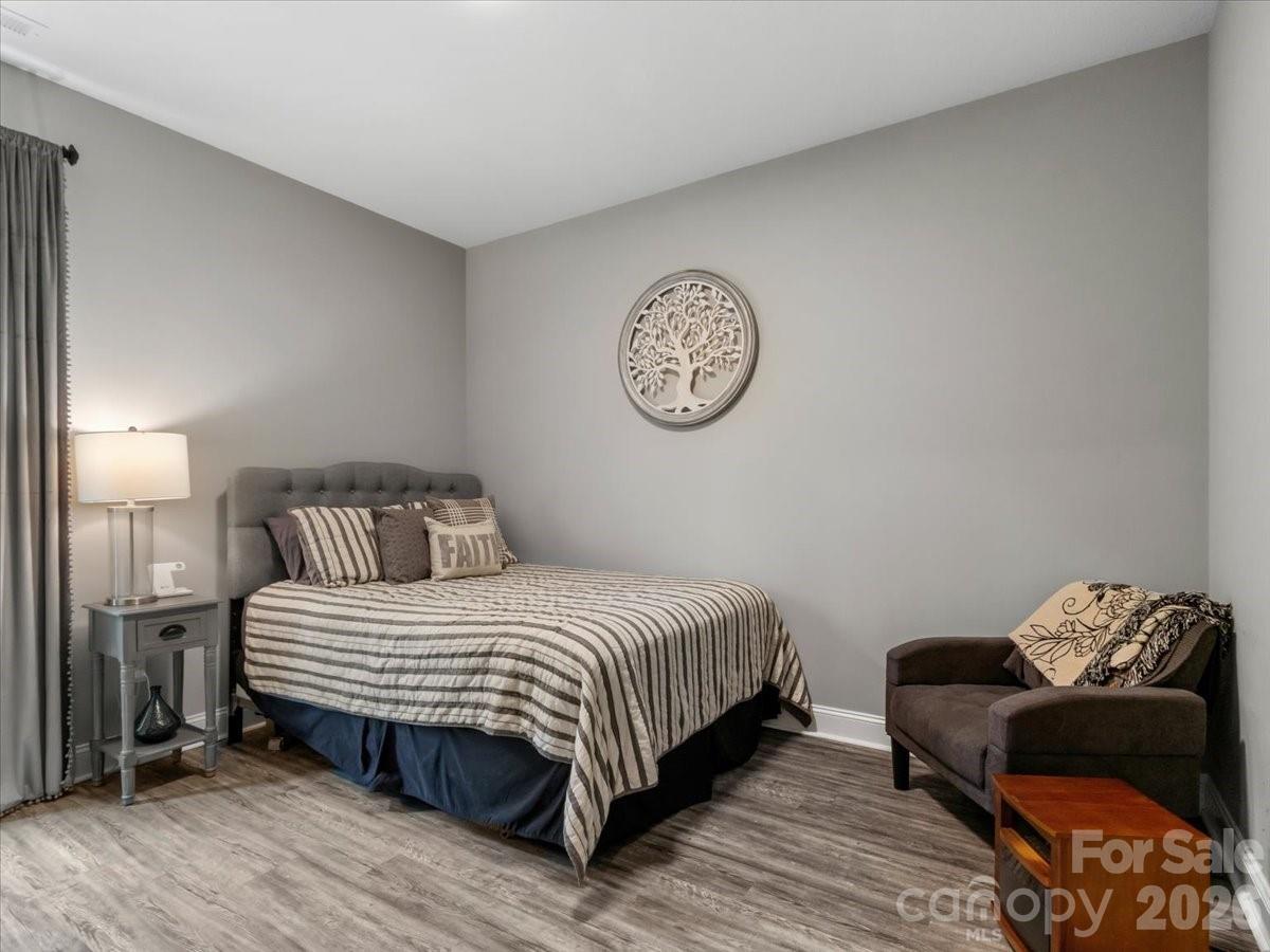 36 Cherry Ridge Lane Weaverville, NC 28787 - Photo 29 of 37 a bedroom with a bed and a lamp