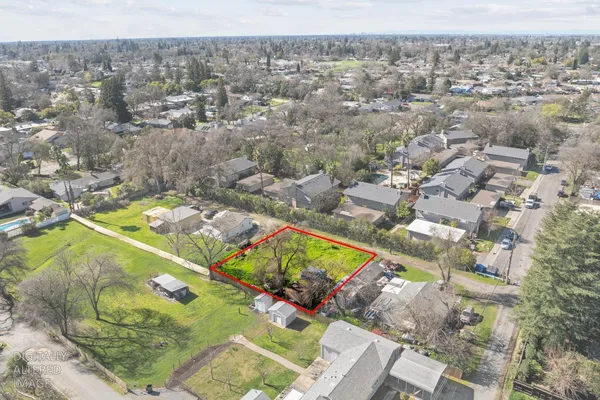 an aerial view of residential houses with outdoor space