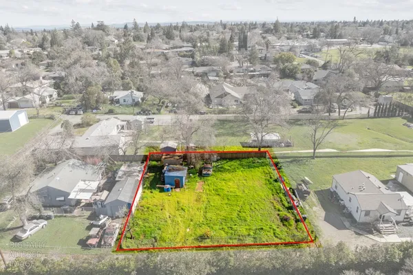 an aerial view of a house with a lake view