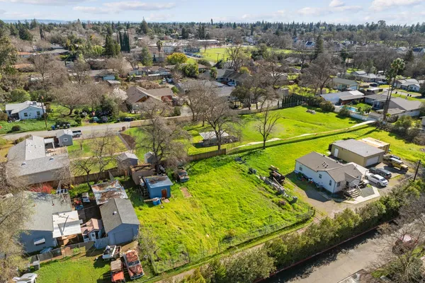 an aerial view of a house with a swimming pool