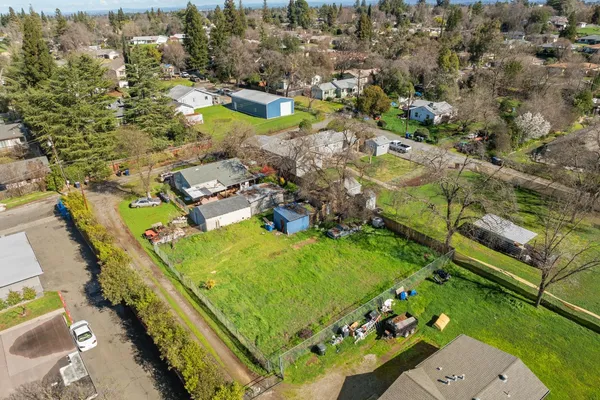 an aerial view of a residential houses with outdoor space
