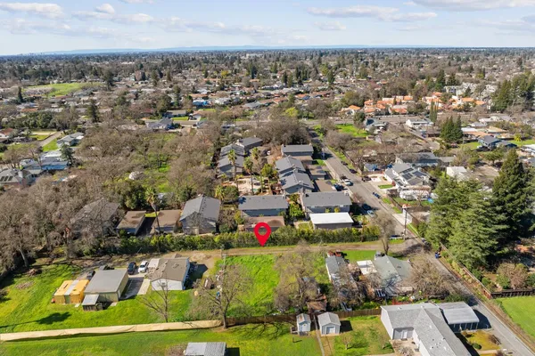 an aerial view of residential houses with outdoor space