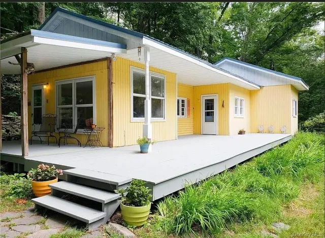 a front view of a house with garden