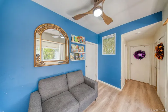 a living room with furniture and a window