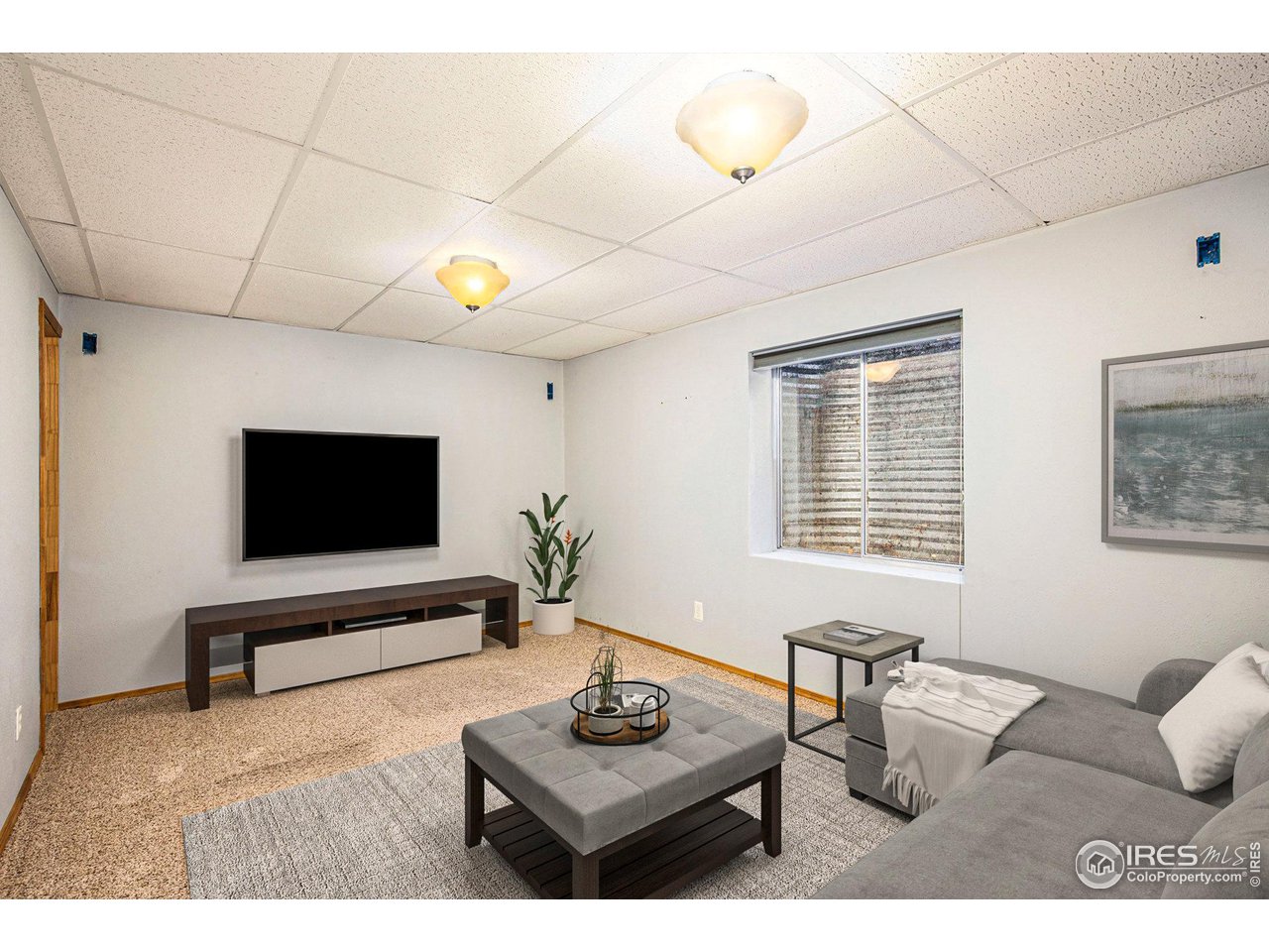 2728 25th Street Road Greeley, CO 80634 - Photo 32 of 40 Lower Level Family Room-Virtually Staged