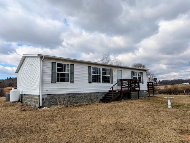 2550 Stonewall Road Northeast Check, VA 24072 - Photo 2 of 22 a view of house and car parked in the yard