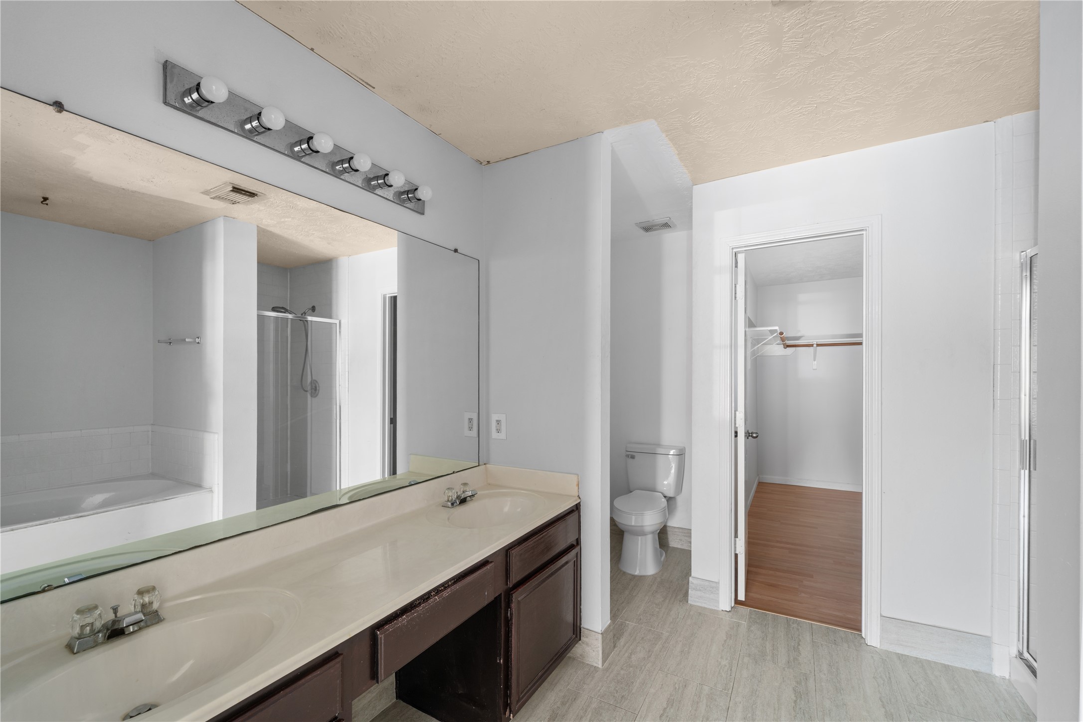 11959 Swords Creek Road Houston, TX 77067 - Photo 17 of 30 a bathroom with a double vanity sink and a mirror