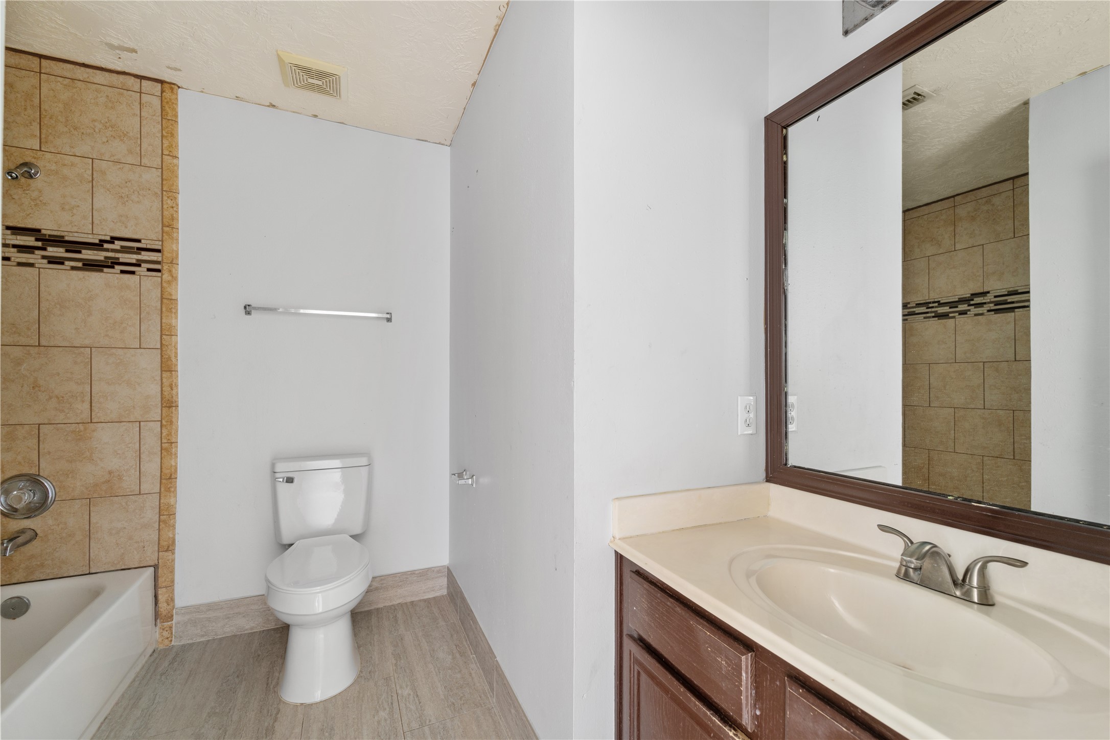 11959 Swords Creek Road Houston, TX 77067 - Photo 21 of 30 a bathroom with a sink toilet and shower