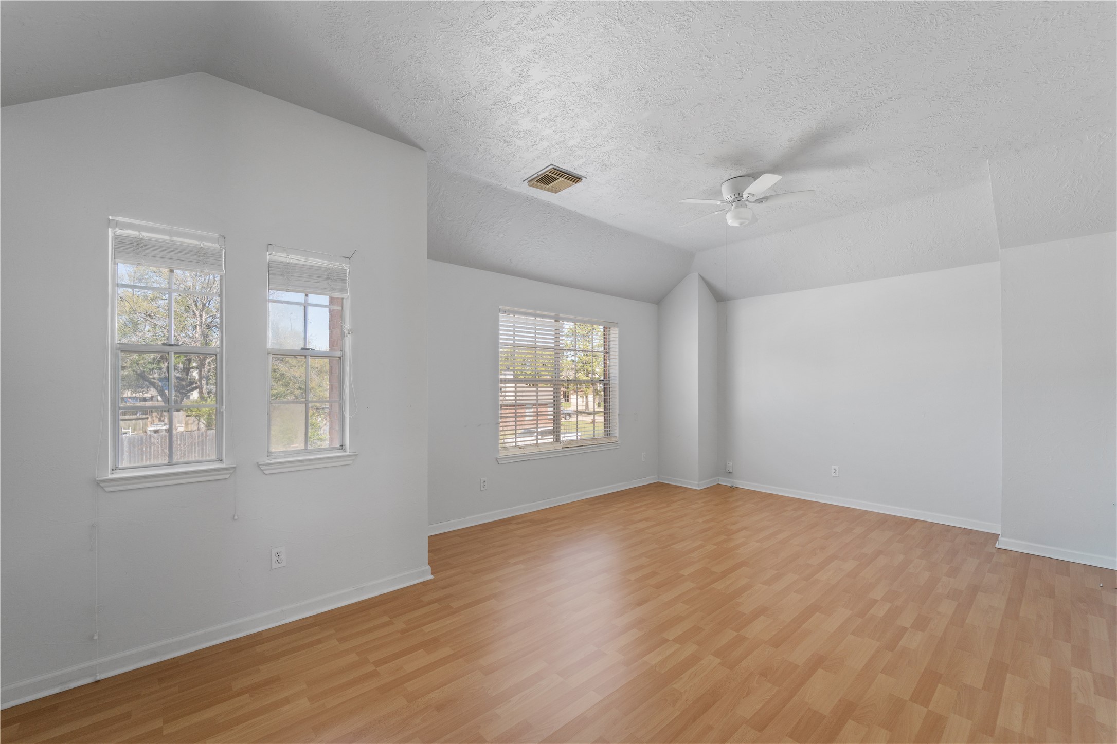 11959 Swords Creek Road Houston, TX 77067 - Photo 26 of 30 a view of an empty room with wooden floor and a window