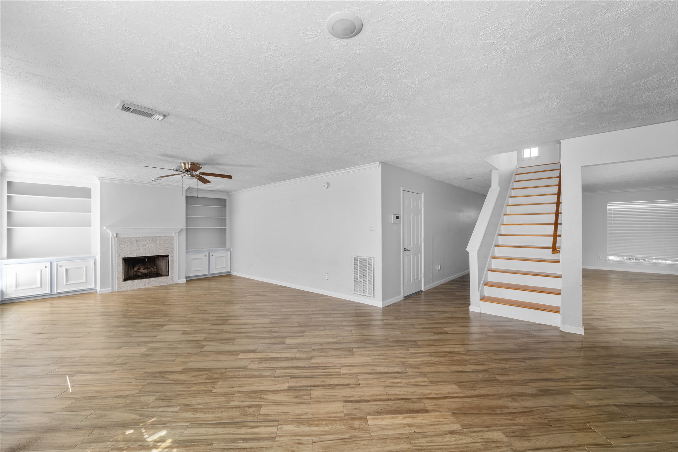 11959 Swords Creek Road Houston, TX 77067 - Photo 7 of 30 a view of empty room with wooden floor