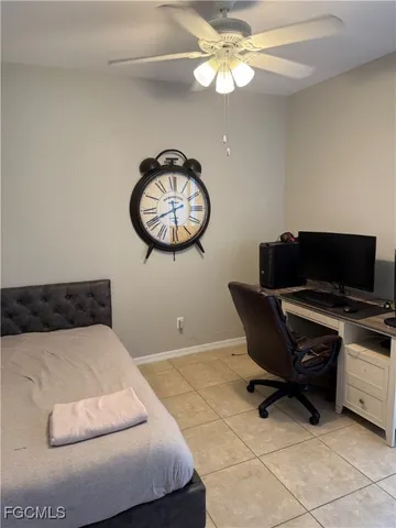 a kitchen with granite countertop a refrigerator and a stove top oven