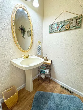 a bathroom with a toilet and a sink
