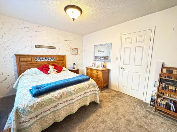a room with wooden floor and washing machine