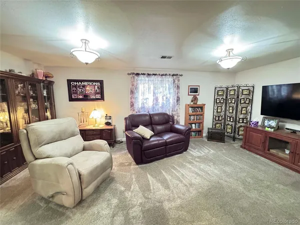 a bedroom with a bed and couch