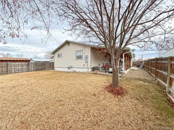 a view of a house with snow on the road