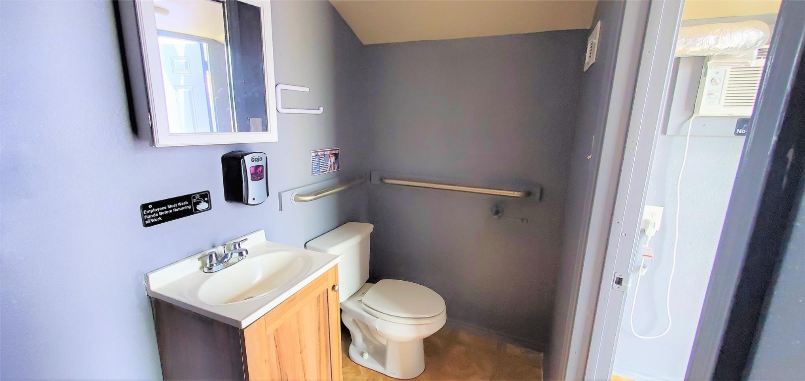 3903 Fulton Street Houston, TX 77009 - Photo 4 of 16 a white toilet sitting next to a bathroom sink