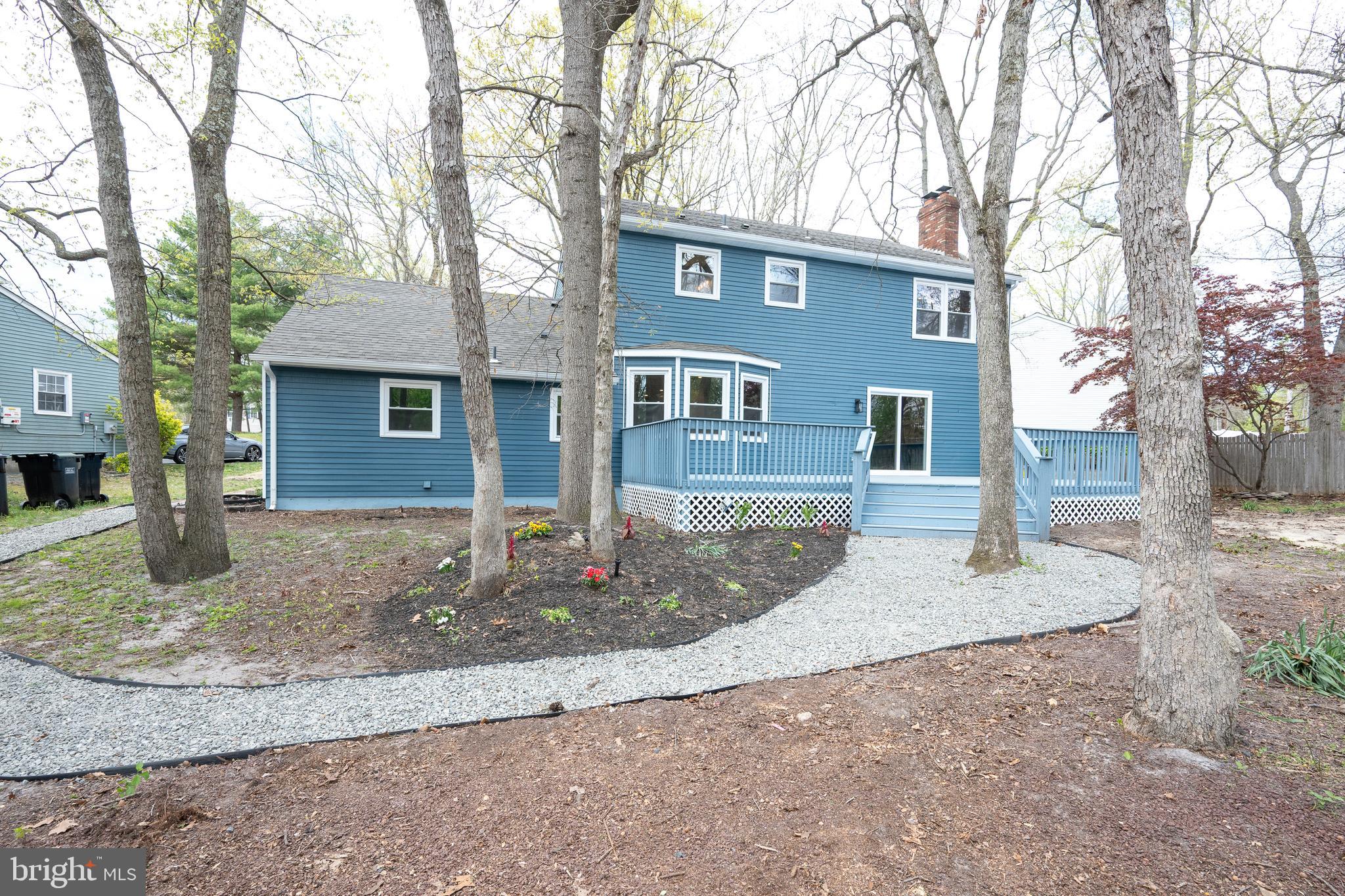 3 Slalom Court Pine Hill, NJ 08021 - Photo 47 of 47 a front view of a house with garden