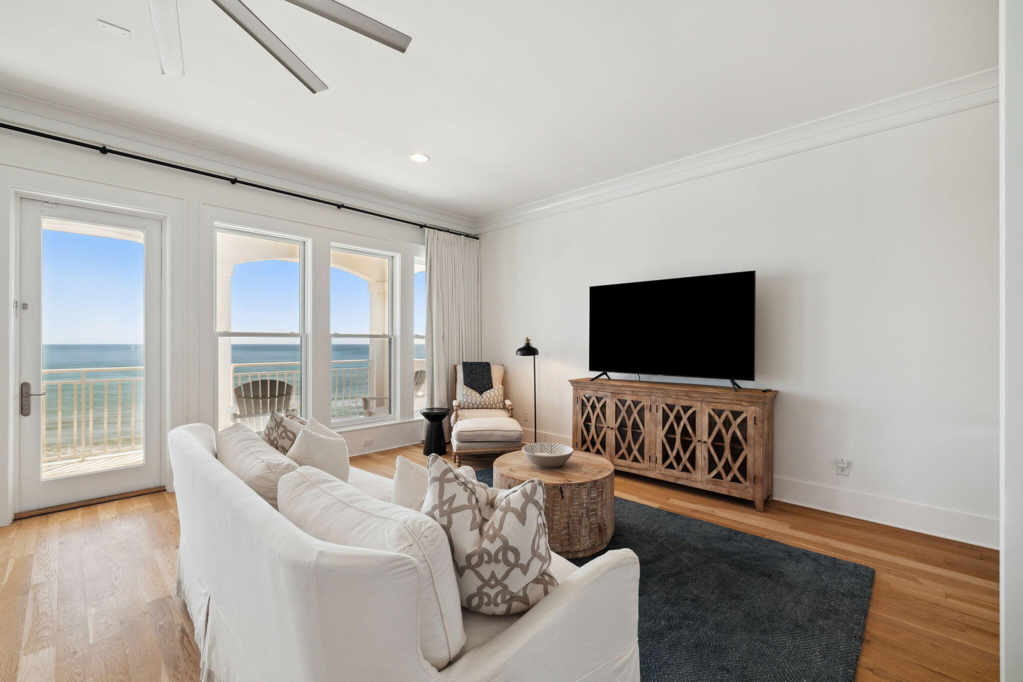 8266 East County Highway 30A Seacrest, FL 32461 - Photo 108 of 148 a living room with furniture and a flat screen tv