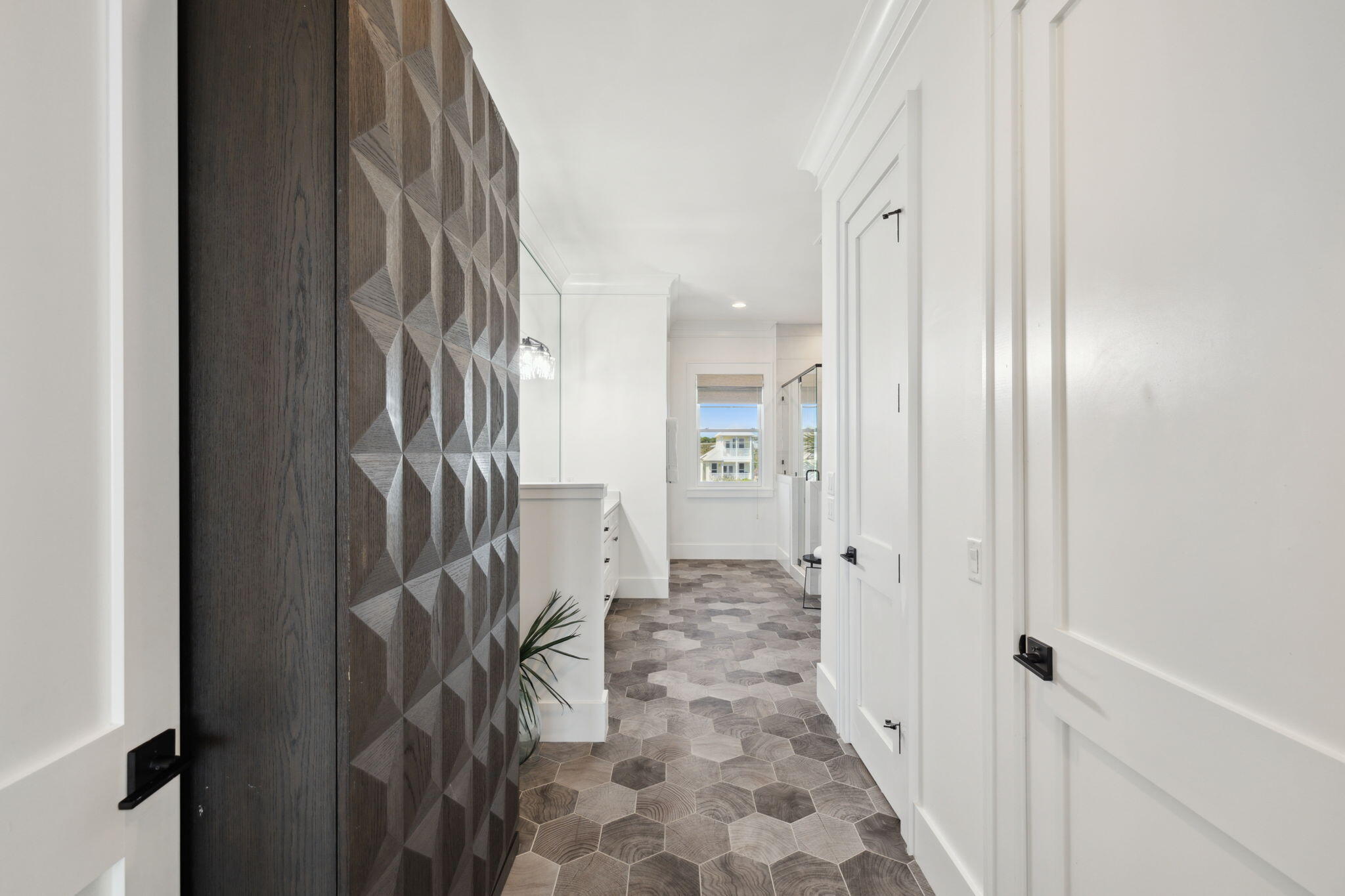 8266 East County Highway 30A Seacrest, FL 32461 - Photo 119 of 148 a view of a hallway with wooden floor and a bathroom