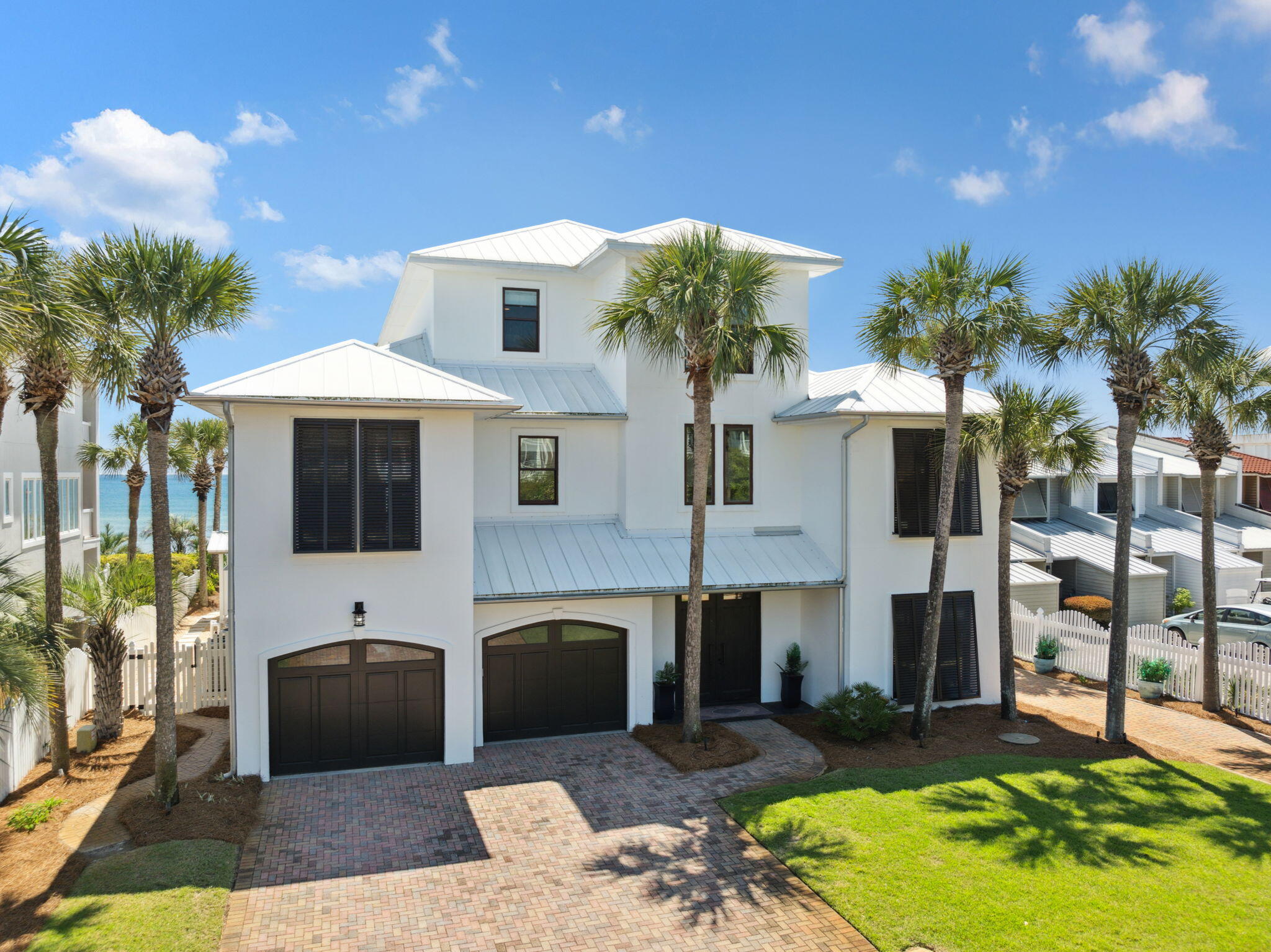 8266 East County Highway 30A Seacrest, FL 32461 - Photo 132 of 148 a front view of a house with yard fire pit and outdoor seating